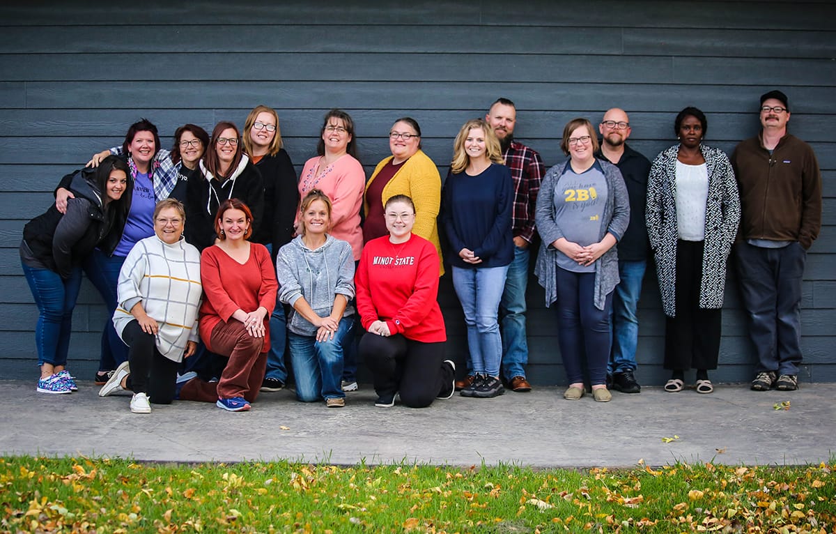 Group of adults smiling for photo